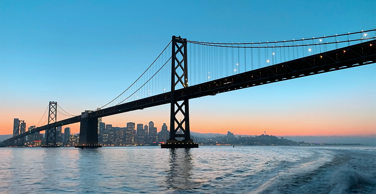 View of the Bay Bridge at dusk.